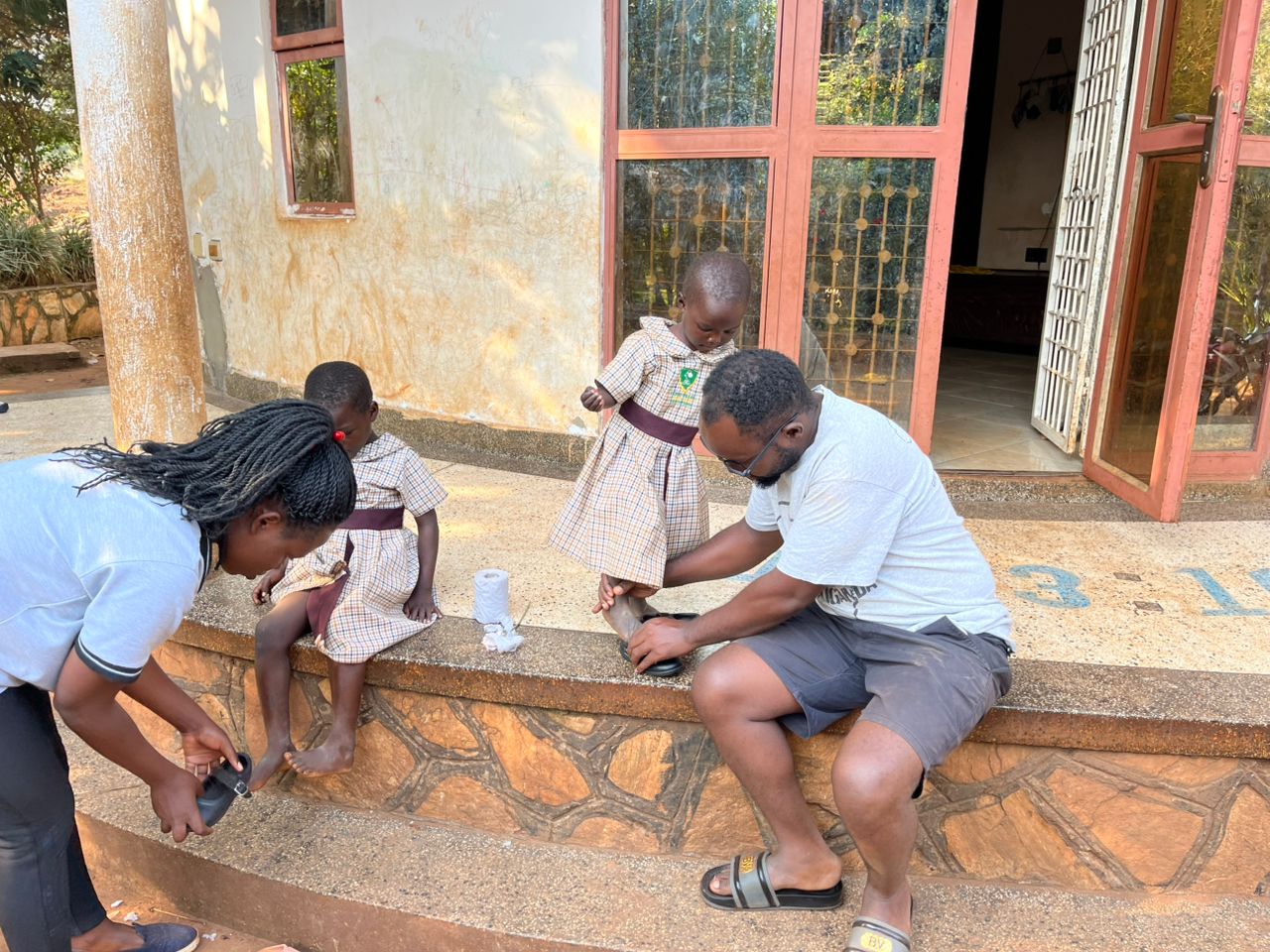 Helping children with shoes